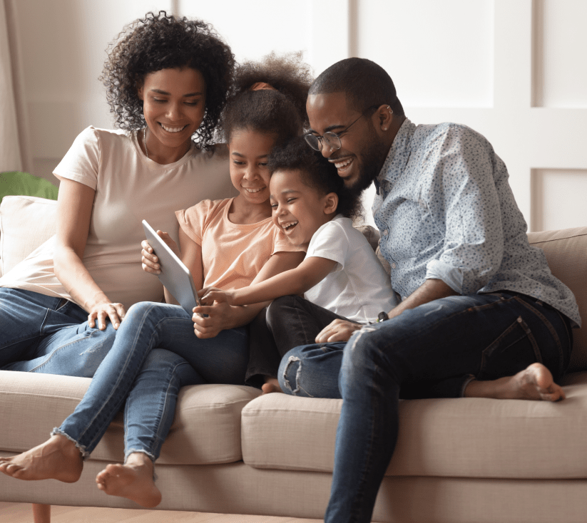 Family using tablet together-min