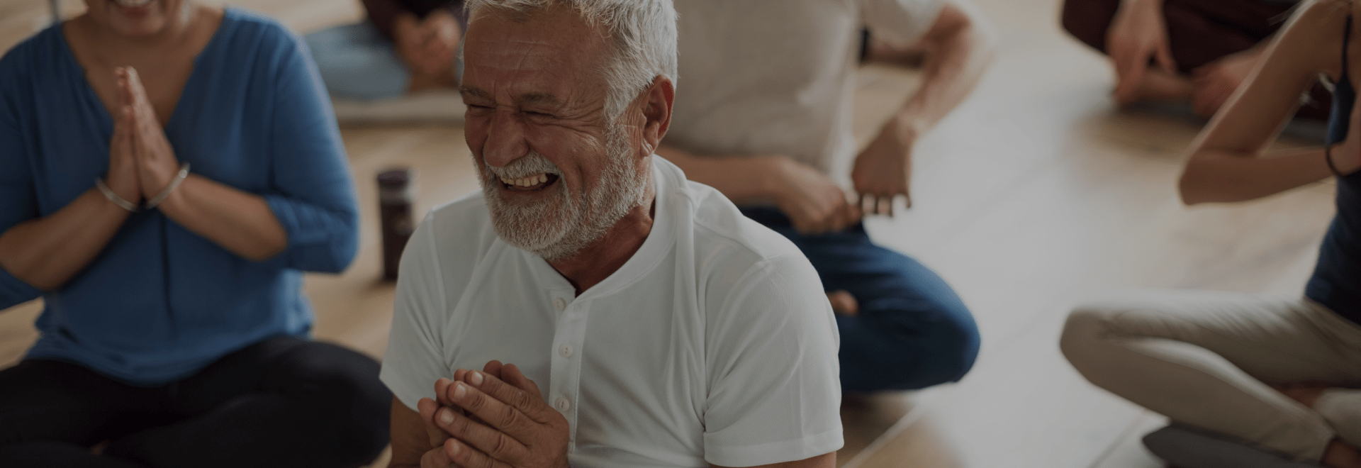 Elderly man in a yoga class