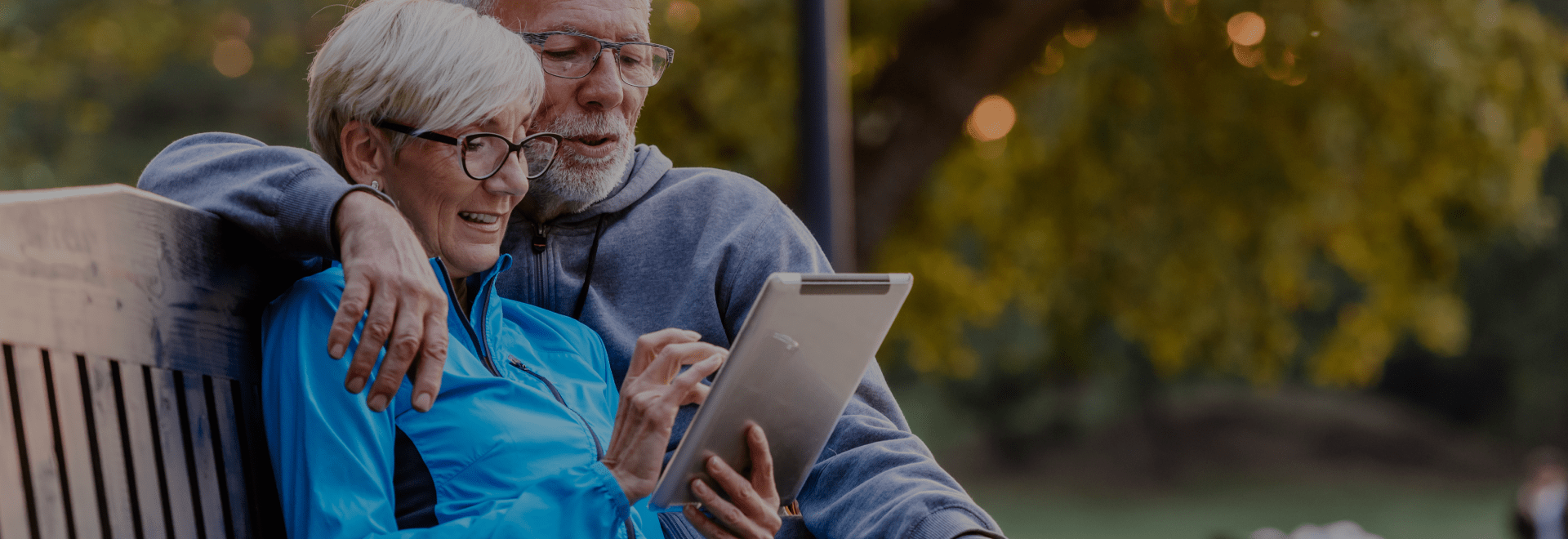 Senior couple using tablet